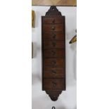 A Regency wall mounting eight drawer spice cupboard, 66cm long