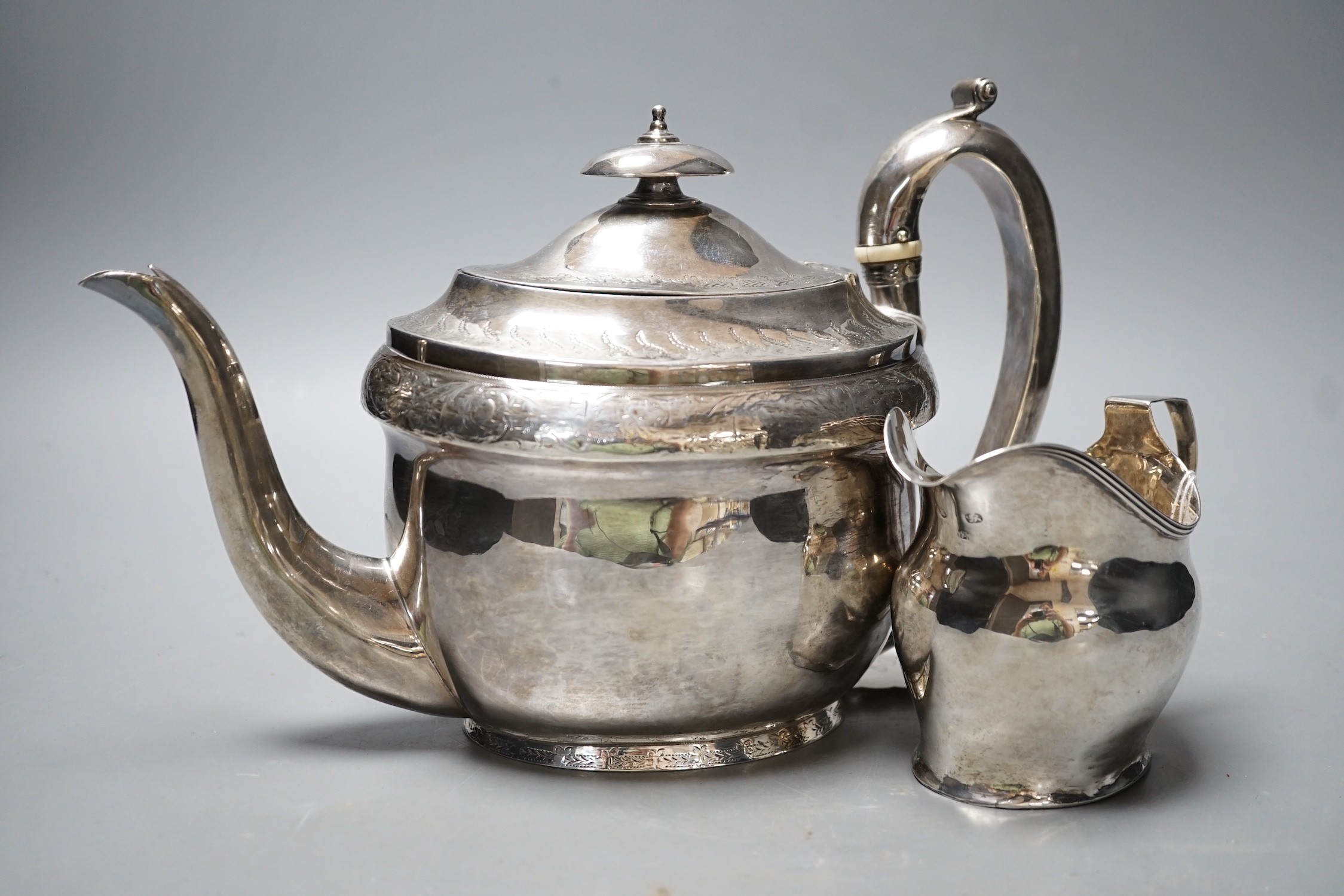 A George III engraved silver oval teapot on stand, Hannah Northcote? London, 1804 and Georgian