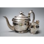 A George III engraved silver oval teapot on stand, Hannah Northcote? London, 1804 and Georgian