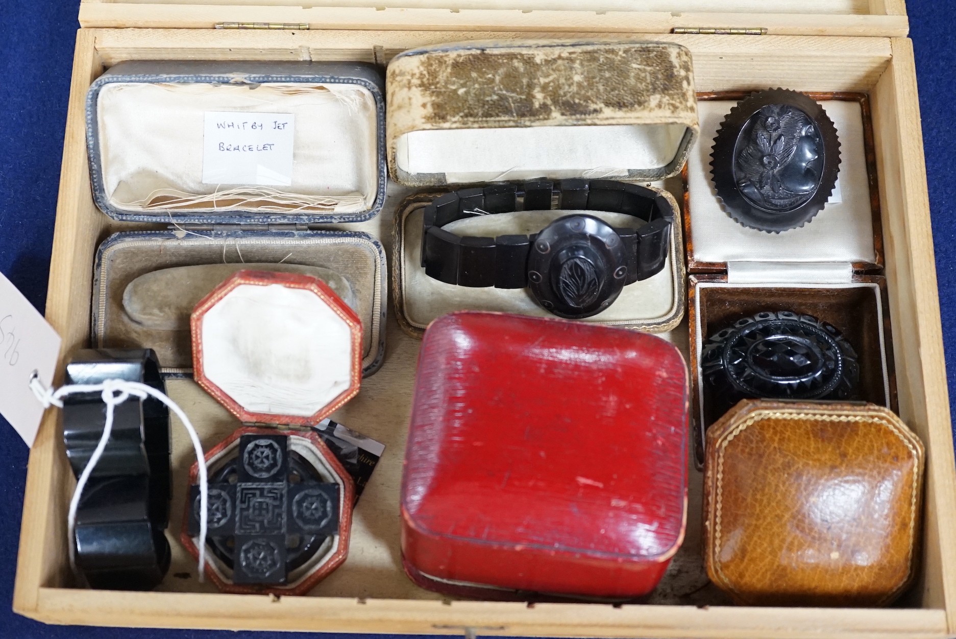 A group of assorted Whitby jet jewellery including three brooches, largest approximately 47mm, three