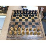 A 19th century faux book chessboard and turned wood chess set