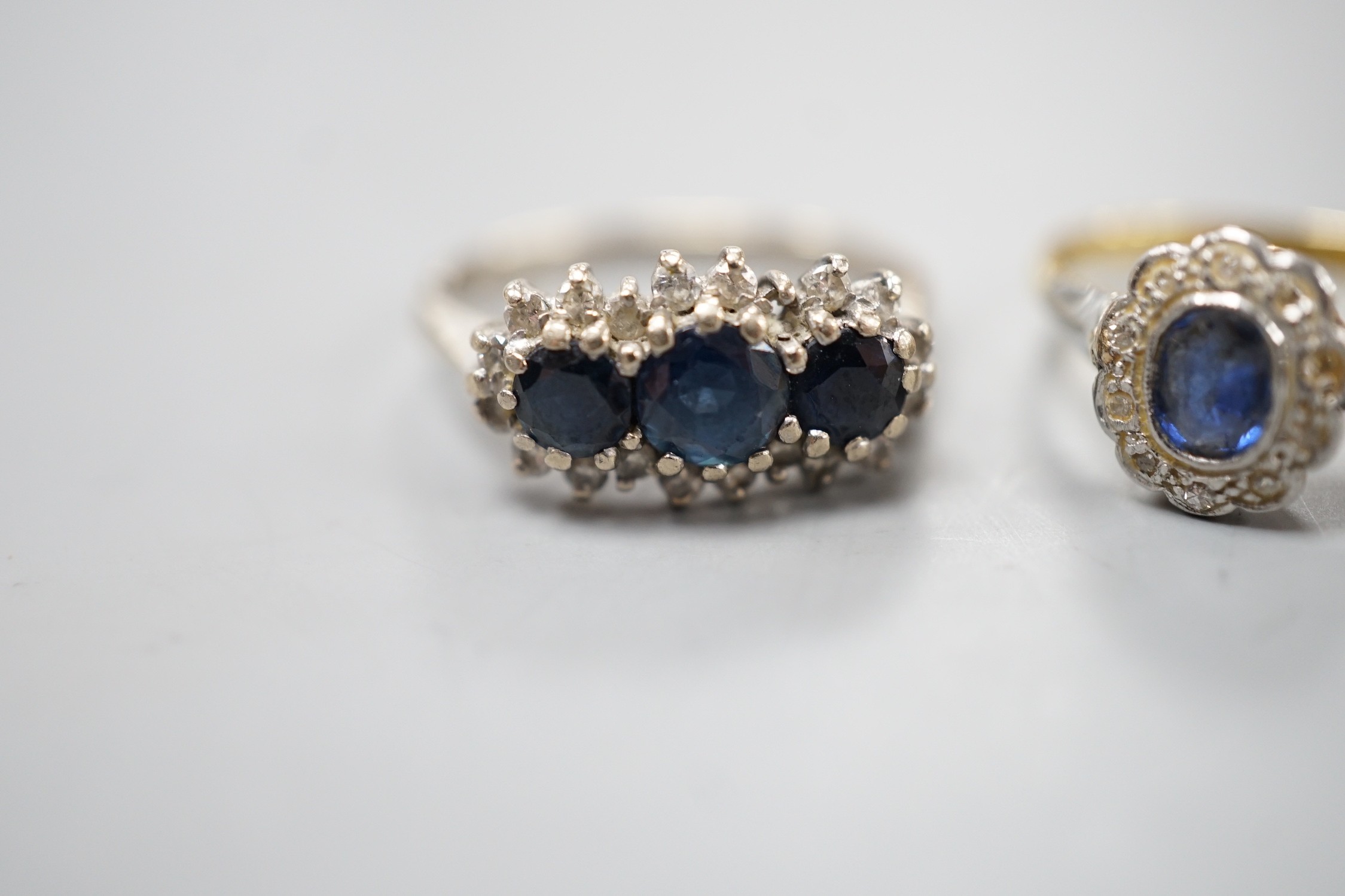 An 18ct white metal, sapphire and diamond set triple cluster ring, size O and a yellow metal, - Image 2 of 4