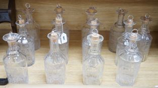 A set of 13 Victorian etched and named glass decanters; Mint, Aniseed, Port, I.Whisky, C.Brandy, G.