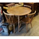 An Ercol elm and beech oval dining table, width 99cm, depth 89cm, height 71cm and four Chiltern