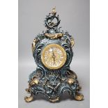 A Louis XV style spelter and parcel gilt mantel timepiece, 37cm