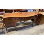 A George III style marquetry inlaid satinwood banded mahogany serpentine sideboard, with brass