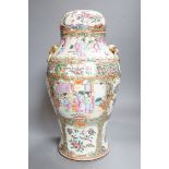 A 19th century Cantonese famille rose baluster vase and cover, the latter lacking a knop finial,