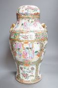A 19th century Cantonese famille rose baluster vase and cover, the latter lacking a knop finial,