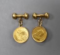 A pair of yellow metal cufflinks, each mounted with a South African 1897 gold pond coin, gross