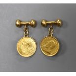 A pair of yellow metal cufflinks, each mounted with a South African 1897 gold pond coin, gross