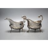 A pair of Edwardian silver sauceboats, with flying scroll handles, Nathan & Hayes, Chester, 1902,
