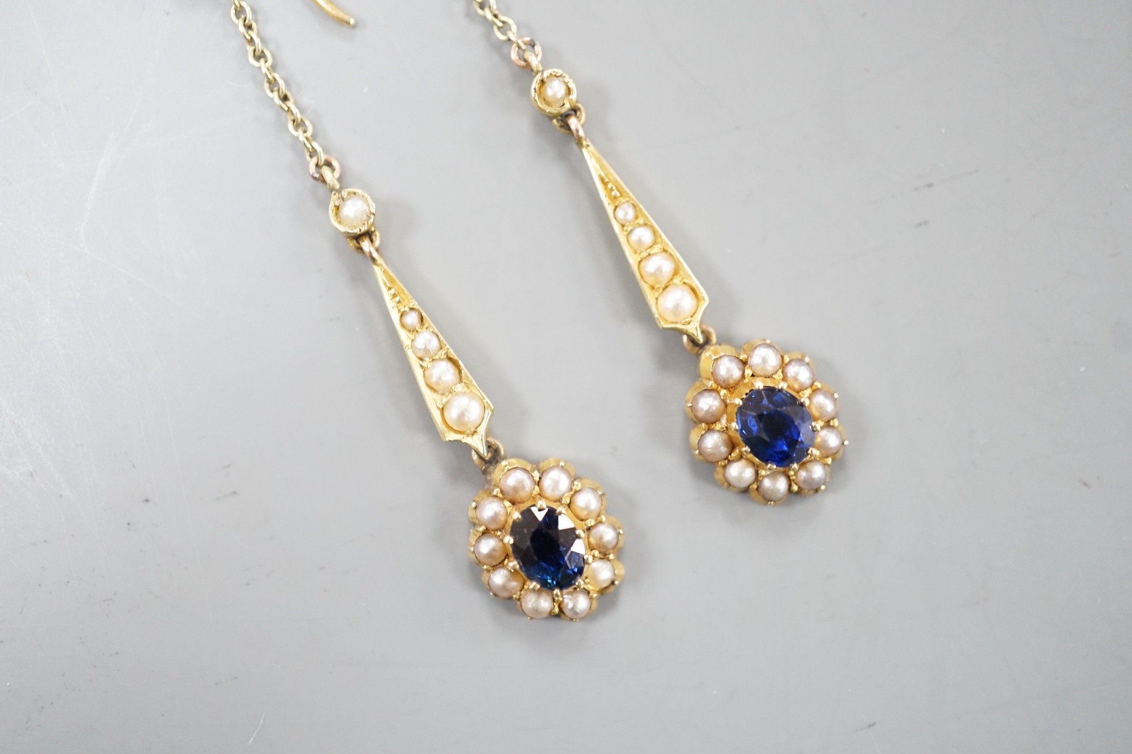 A pair of yellow metal, sapphire and seed pearl set drop earrings. 41mm, gross weight 3.4 grams. - Image 2 of 4