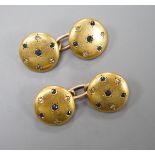 A pair of yellow metal, sapphire and diamond chip set circular cufflinks, diameter 12mm, gross