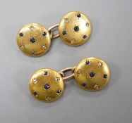 A pair of yellow metal, sapphire and diamond chip set circular cufflinks, diameter 12mm, gross