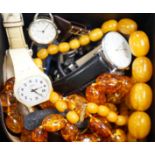 A quantity of assorted gentleman's modern wrist watches and two necklaces including amber style.