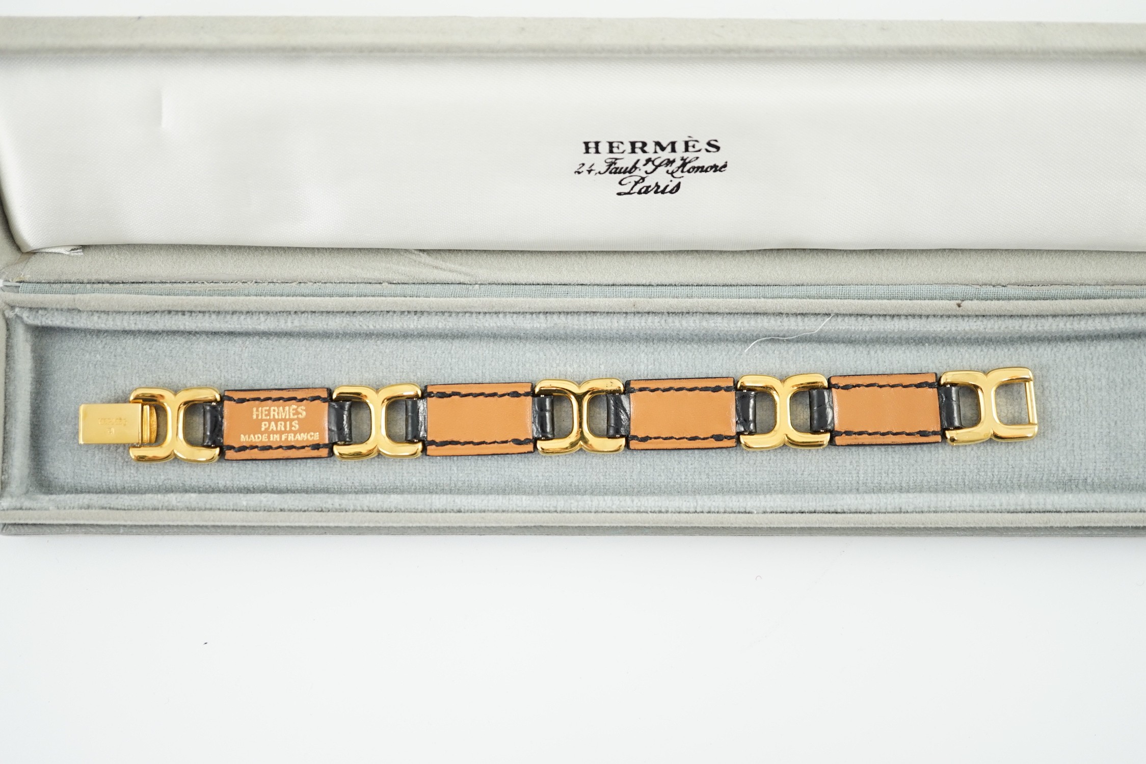 A boxed Hermes navy blue leather and gilt metal bracelet, 19cm. - Image 3 of 4