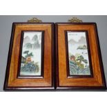 A pair of Chinese framed porcelain plaques 25x15cm including frame