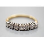 An 18ct gold and seven stone diamond set half hoop ring, size K, gross weight 1.8 grams.