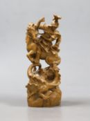 A Continental limewood group of St George and the dragon. 14cm high