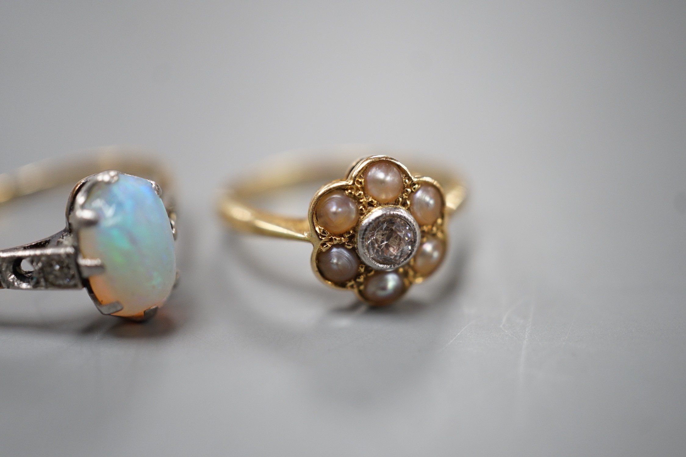 An 18ct and Plat, split pearl and diamond cluster set ring, size F/G and a similar white opal set - Image 3 of 5