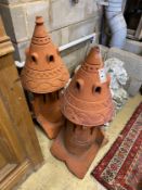 A pair of terracotta hip tiles modelled as dovecote, height 89cm