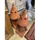 A pair of terracotta hip tiles modelled as dovecote, height 89cm