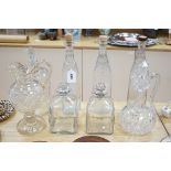 A Victorian cut glass Claret jug and stopper, a step cut pedestal jug, a pair of Dutch decanters,