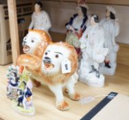 A group of 19th century Staffordshire flat backs and a pair of late Staffordshire pottery lions,