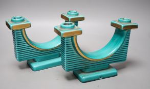 A pair of French turquoise glazed two branch candlesticks, 21.5cm wide