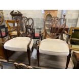 A set of eight Hepplewhite style mahogany dining chairs, two with arms