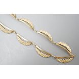 A 1960's part textured 9ct gold fringe necklace, 39cm, 14.1 grams.