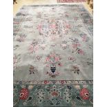 A Chinese Celadon ground floral blue ground carpet, approx. 544 x 366cm