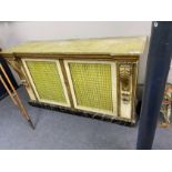 A Regency style cream and giltwood two door cupboard, with a faux green marble top, width 185cm,