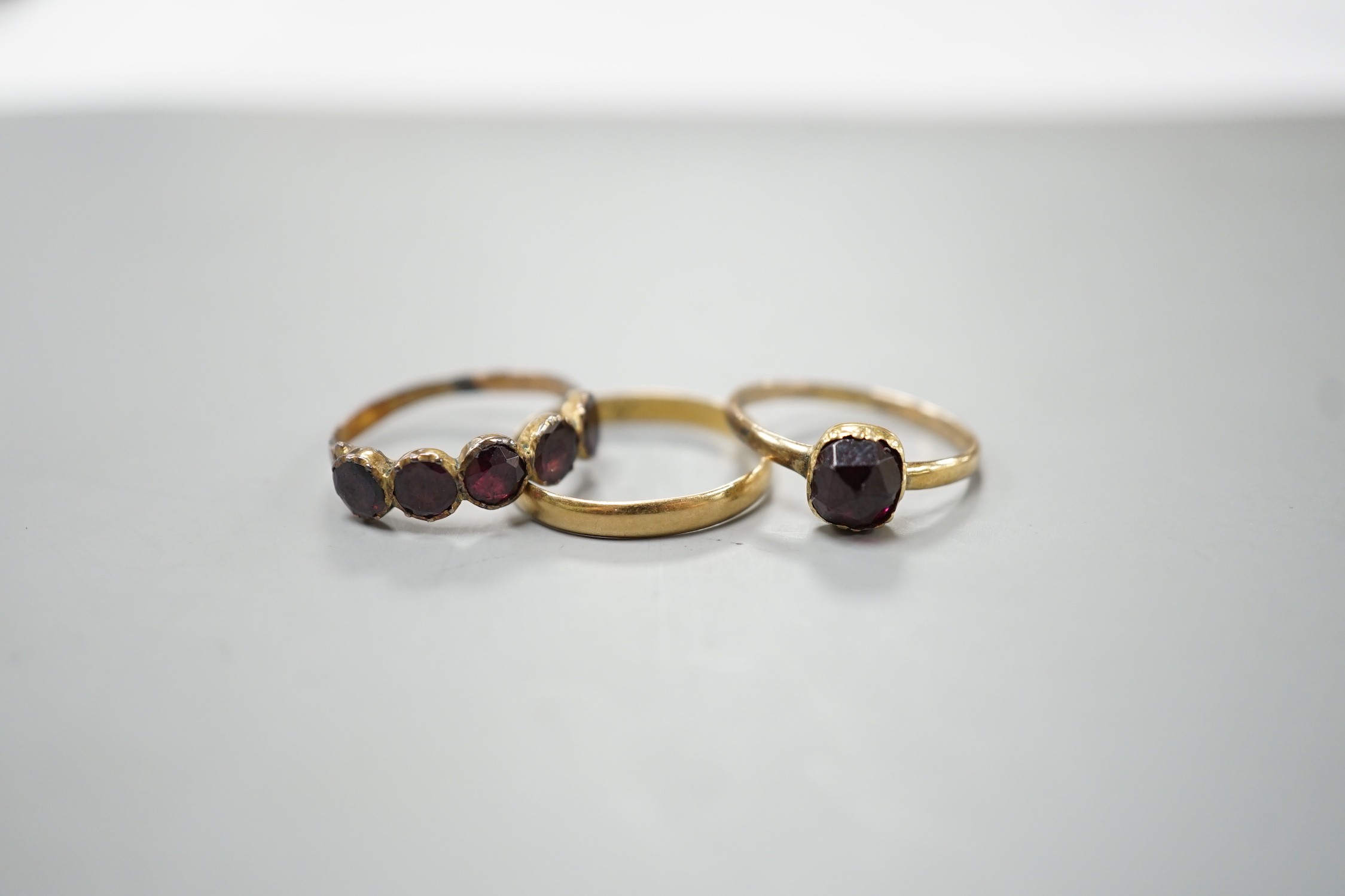 Two 19th century yellow metal and garnet set rings, including five stone half hoop, size J and - Image 2 of 3