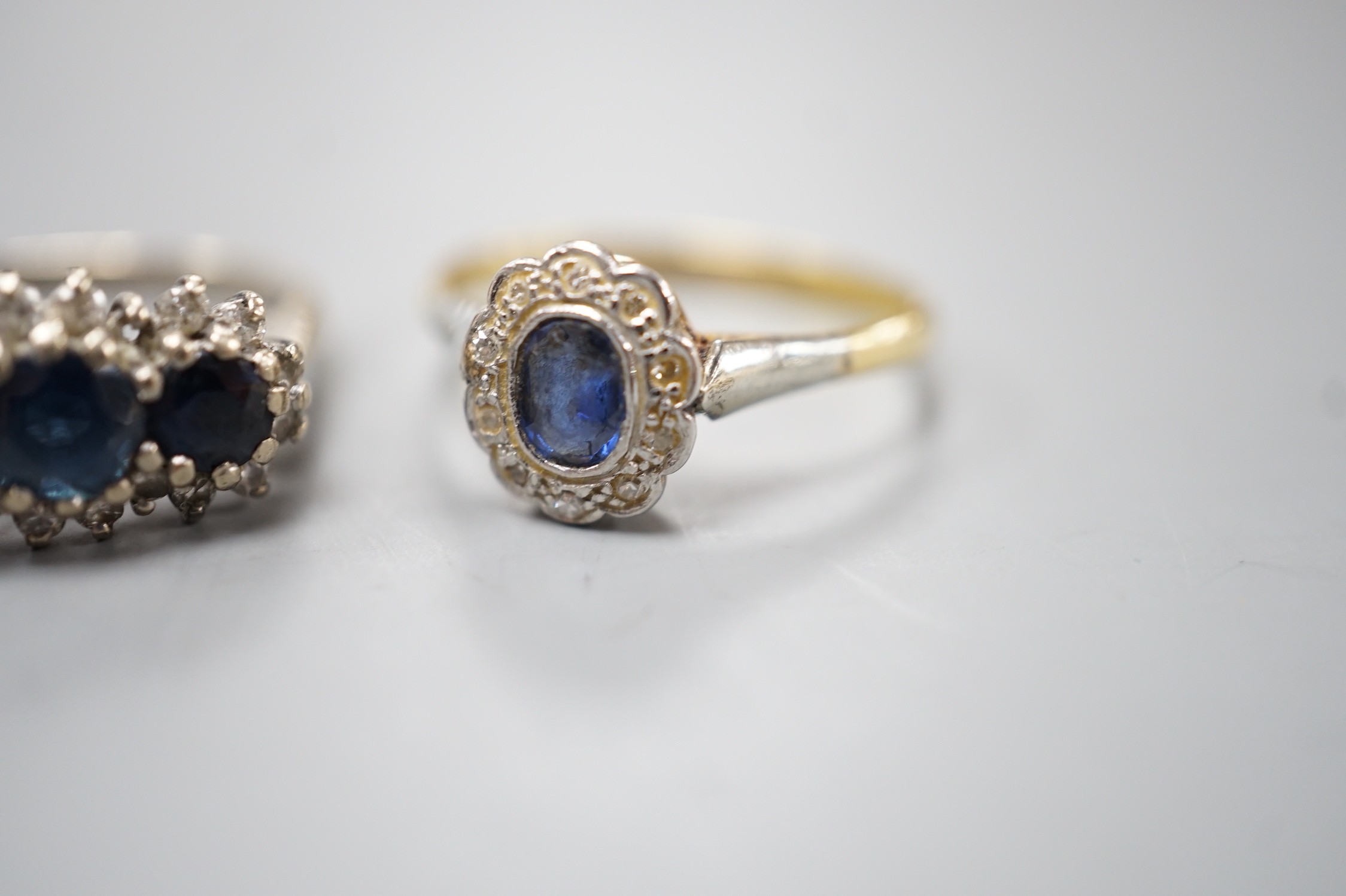 An 18ct white metal, sapphire and diamond set triple cluster ring, size O and a yellow metal, - Image 3 of 4