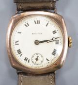 A gentleman's 1920's 9ct gold Rolex manual wind wrist watch, on associated strap, with case back