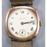 A gentleman's 1920's 9ct gold Rolex manual wind wrist watch, on associated strap, with case back