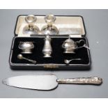 A cased George V silver three piece condiment set, Birmingham, 1930, a Victorian engraved silver