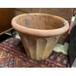 A circular terracotta garden planter, diameter 54cm, height 39cm