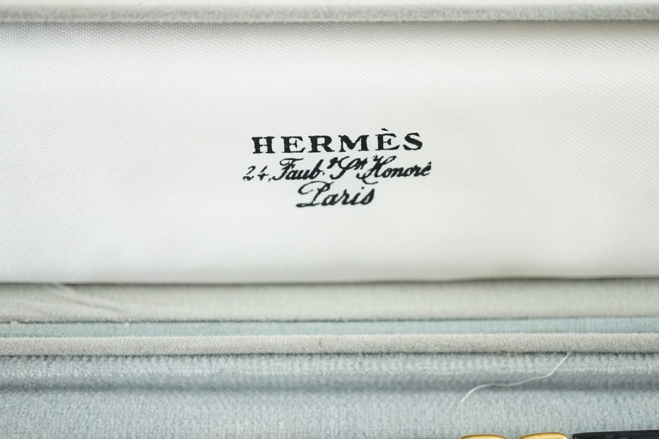 A boxed Hermes navy blue leather and gilt metal bracelet, 19cm. - Image 2 of 4