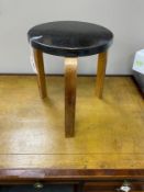 An Alvar Aalto three-legged stool, seat diameter 35cm, height 44cm