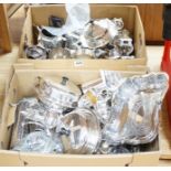 A large quantity of silver plated items including tea sets, egg cruet, goblet, cups, muffin dish and