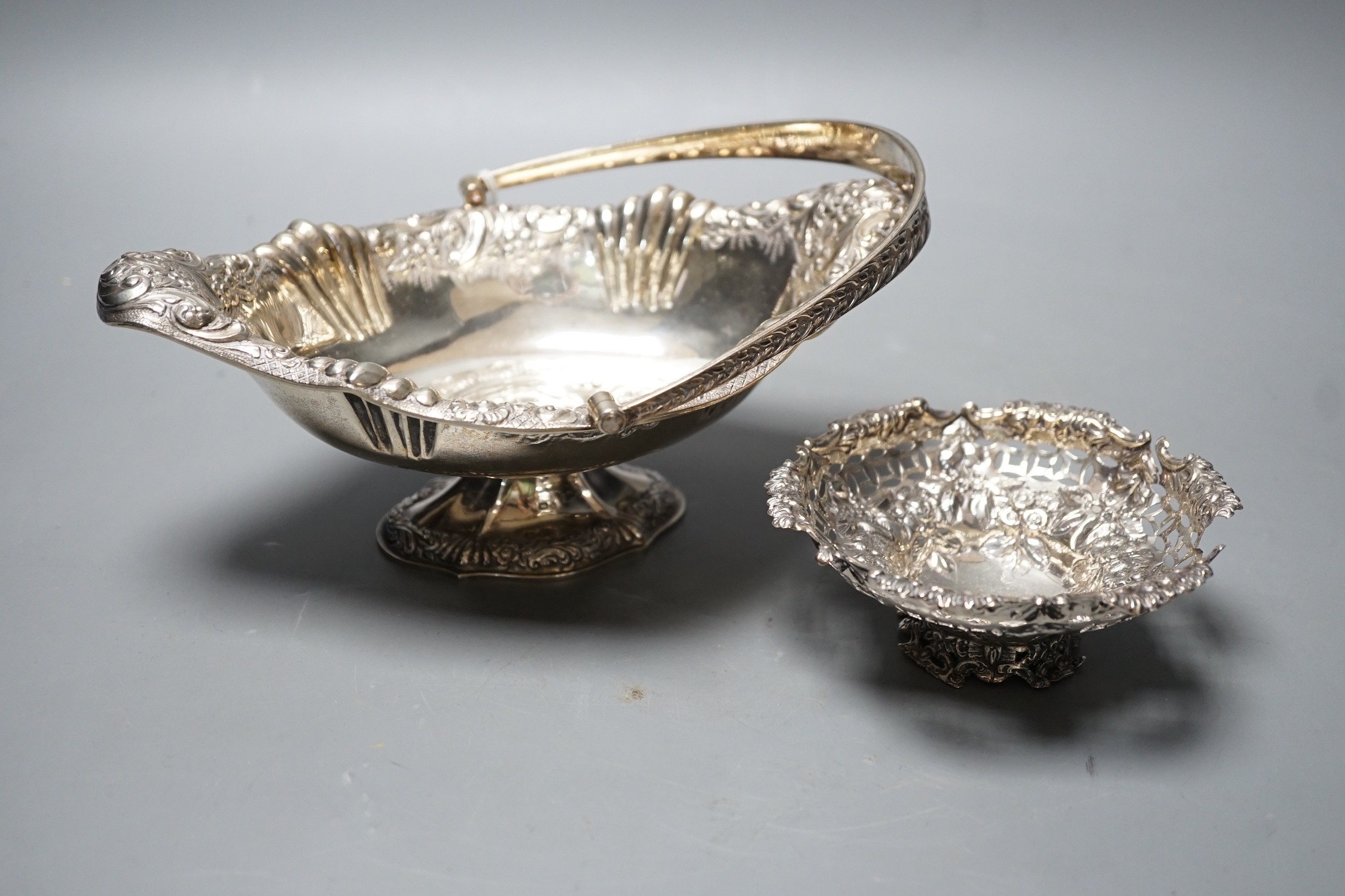 A late Victorian silver oval embossed bon bon basket , Chester, 1893, 21.4cm,and a small bon bon