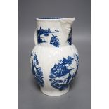 A Caughley baluster mask jug of cabbage leaf moulded shape, printed in underglaze blue with five