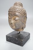 A Chinese stone Buddha’s head on stand 19cm total height