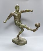 H. Fugere. A large patinated spelter figure of a football player, 50cm tall