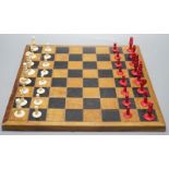 A 19th century bone chess set, Kings 7 cm with a later inlaid chessboard chess board