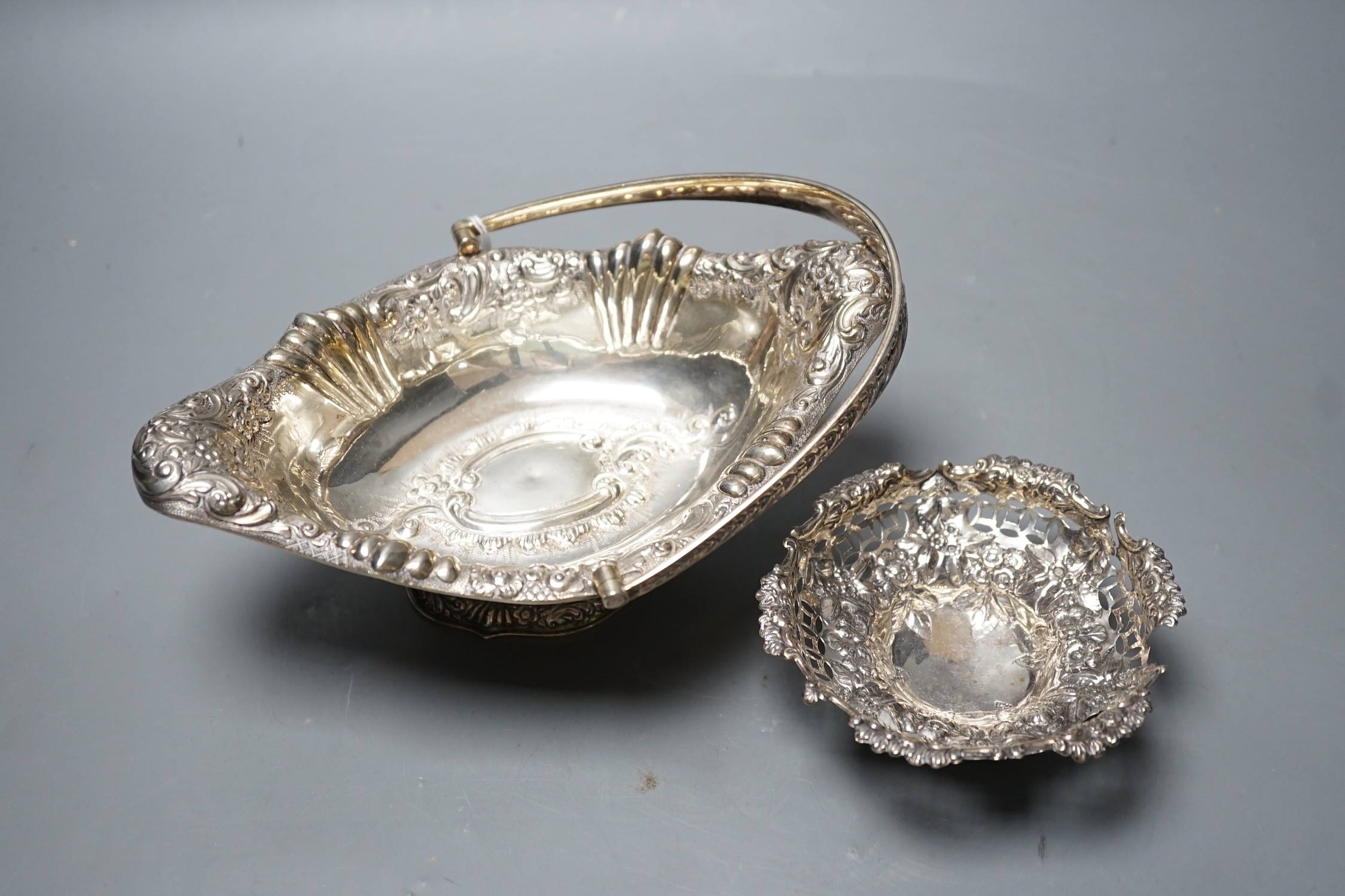 A late Victorian silver oval embossed bon bon basket , Chester, 1893, 21.4cm,and a small bon bon - Image 2 of 2