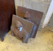 A pair of cast stone abstract portrait relief wall plaques, initialled M J E, larger width 48cm,