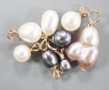 Seven assorted modern yellow metal mounted cultured pearl pendants and a similar white metal mounted
